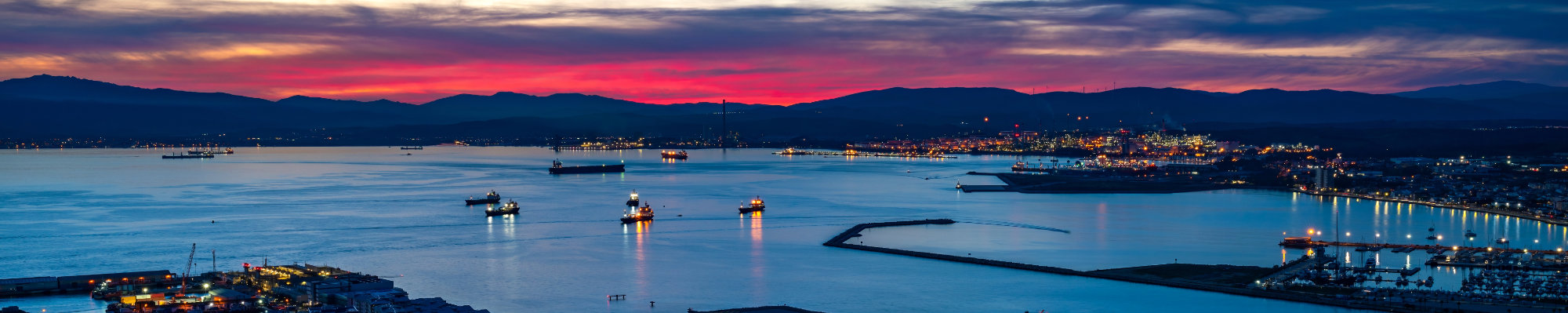 Colorful sunset over Gibraltar town and the Bay of Gibraltar, UK