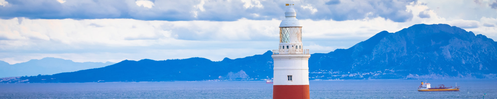 Europa Point Lighthouse in Gibraltar and Africa coastline view, Gibraltar straight